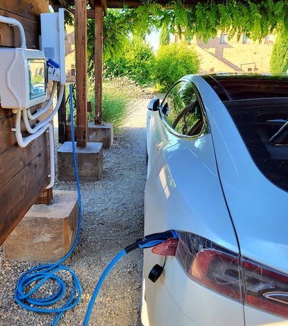 Cunina Solar panels recharging a Tesla